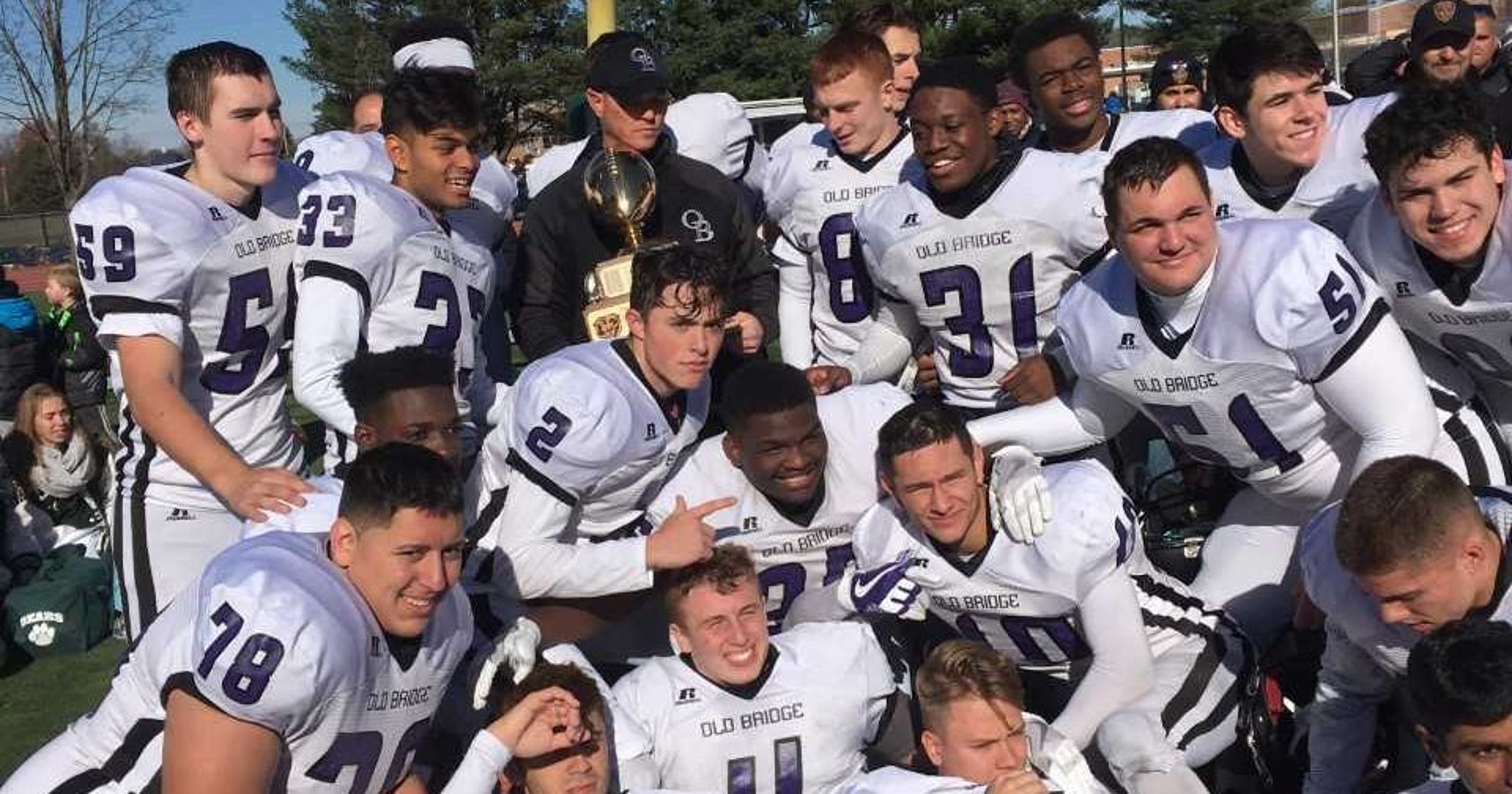 636470515936492657-Old-Bridge-football-players-celebrate